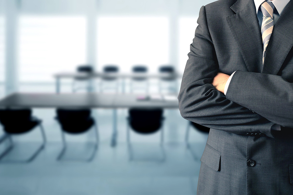 Businessman standing in a conference room