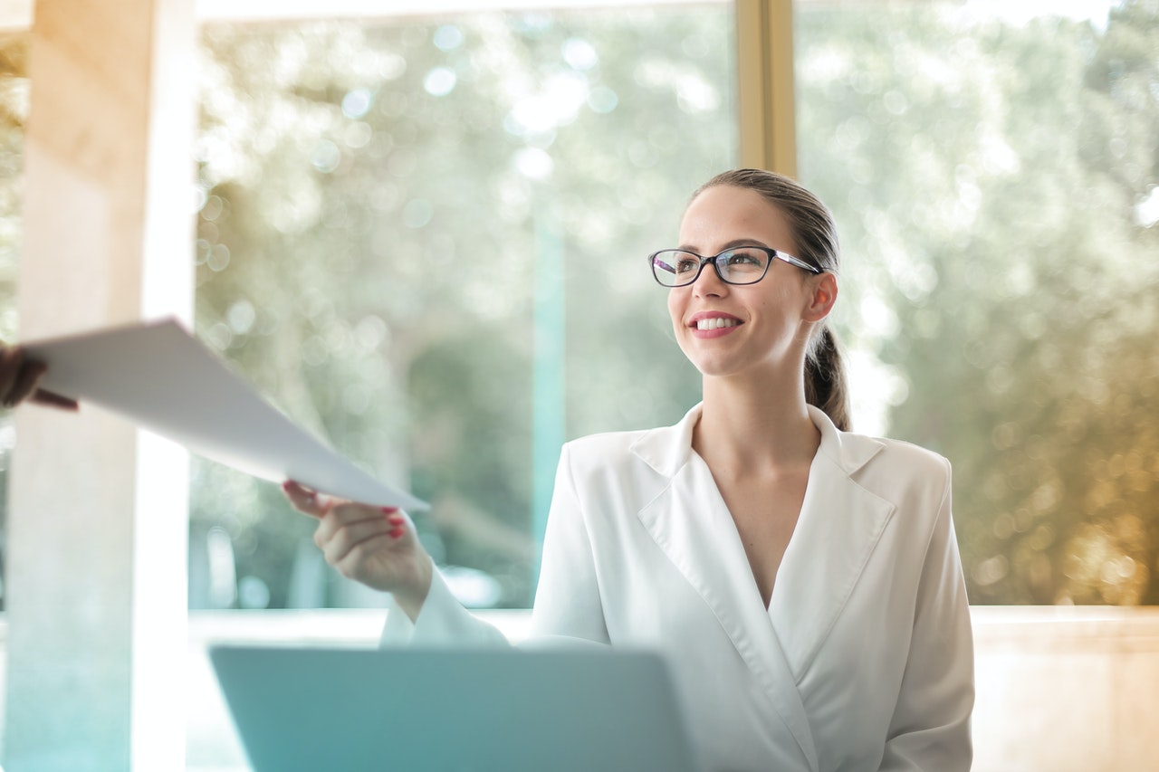 Positive Business Woman Doing Paperwork
