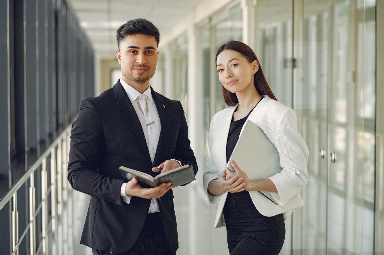 Realtors Holding Notebook and Laptop