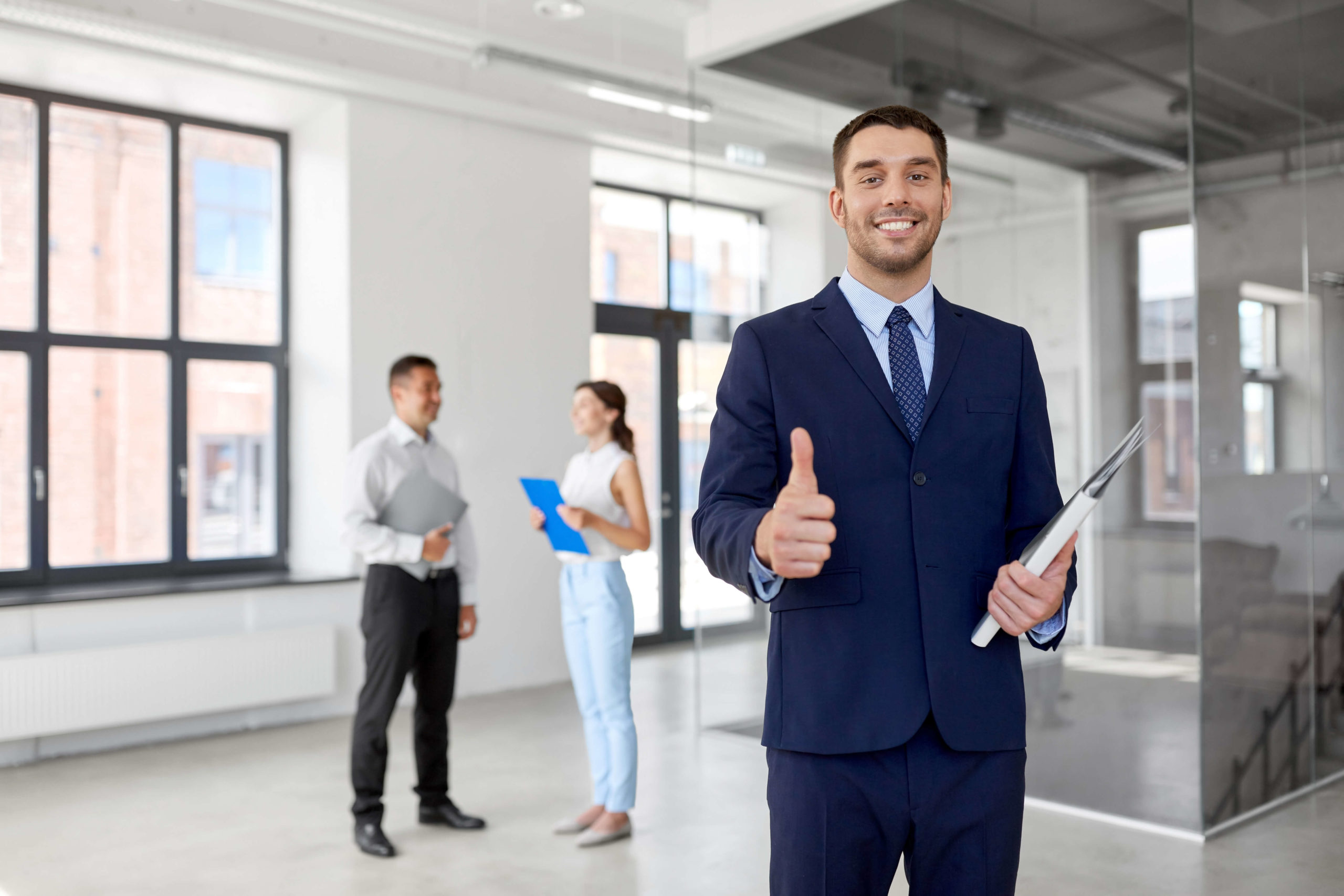 Young Businessman Giving Thumbs Up